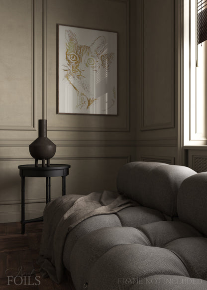 Grey sofa in a room with a framed artwork of a pet cat on the wall.